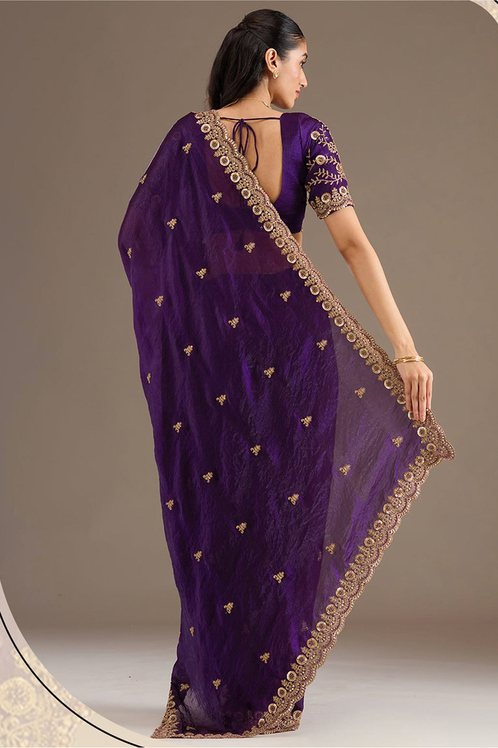 Purple Saree styled for wedding reception evening wear