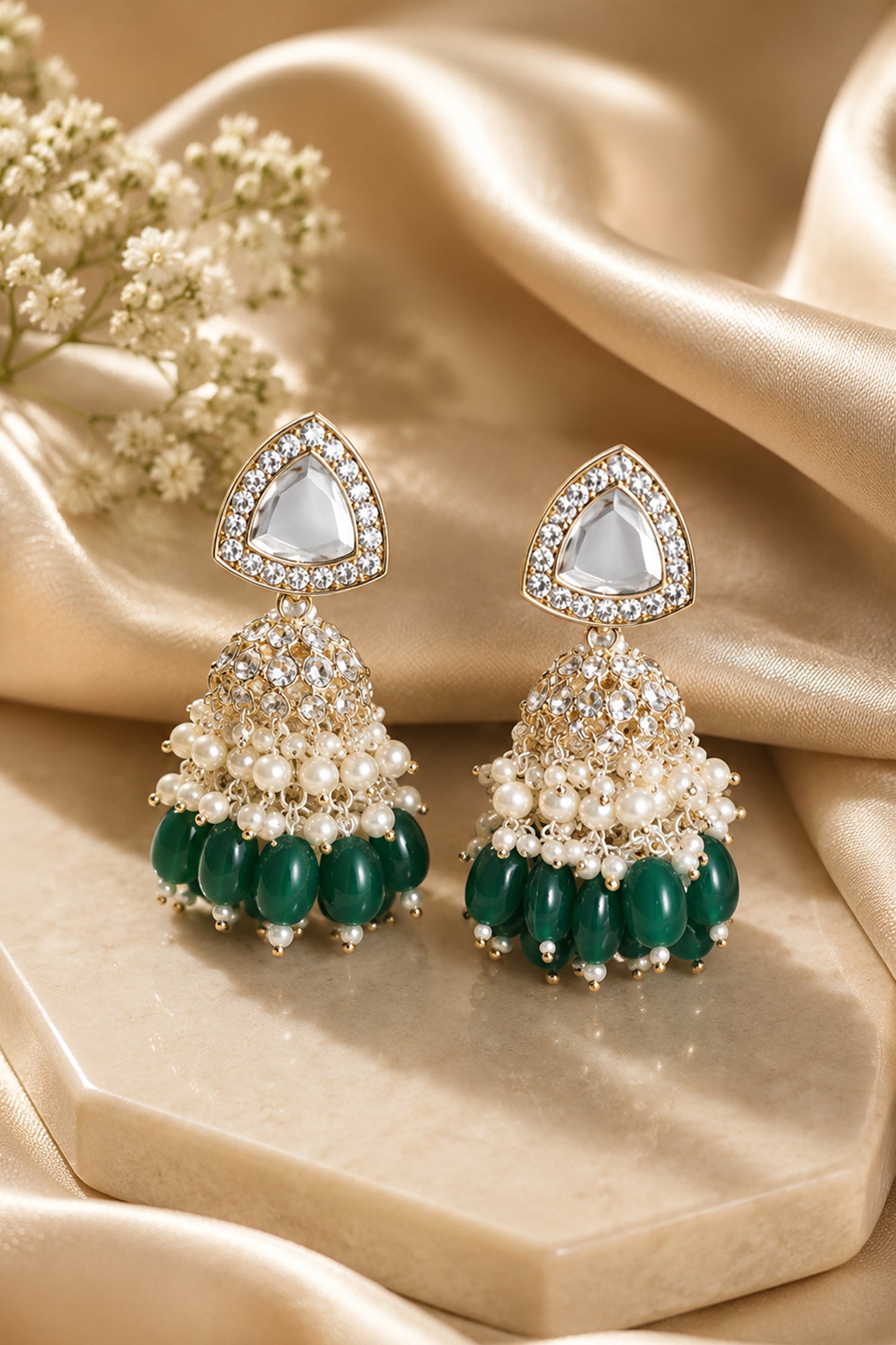 Close-up of triangular clear-stone top and layered jhumka dome