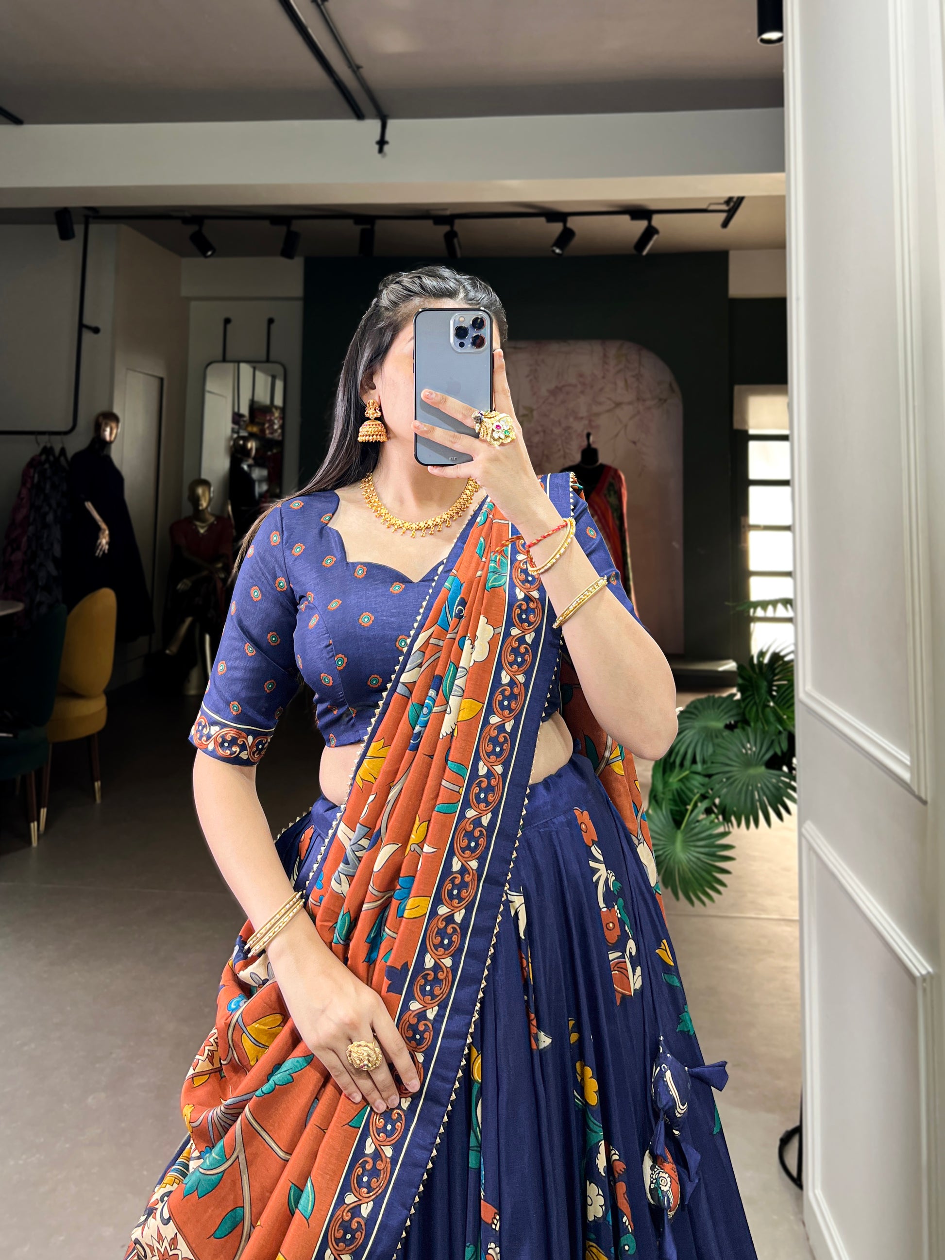 Close-up of Kalamkari work on navy blue color lehenga