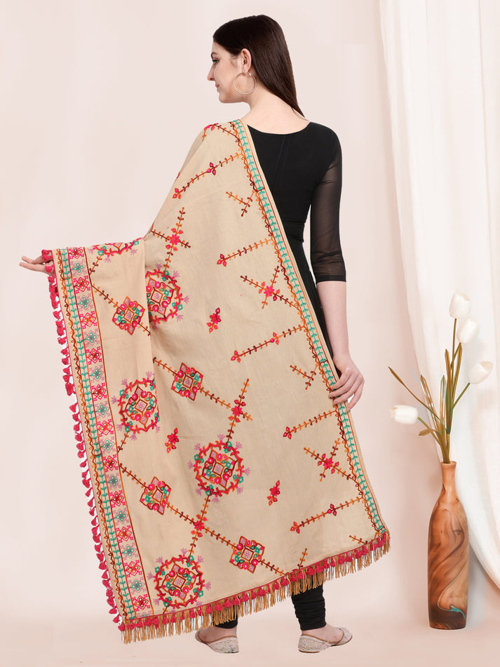 Cream dupatta flat lay highlighting embroidery texture