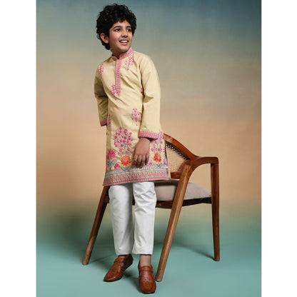 Side profile of yellow embroidered kurta set