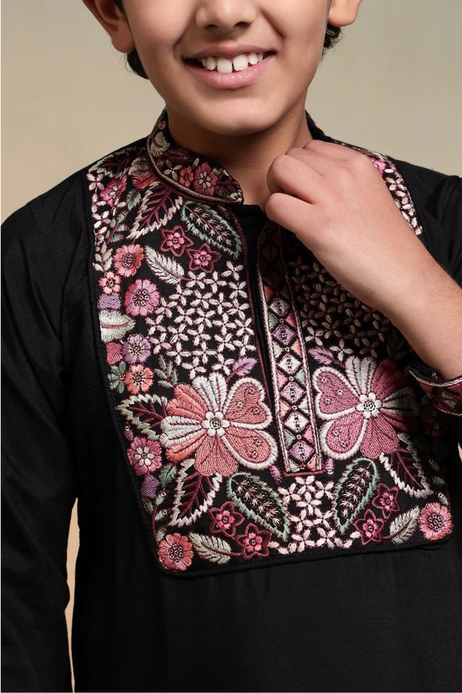 Close up of thread and sequence embroidery on boys kurta