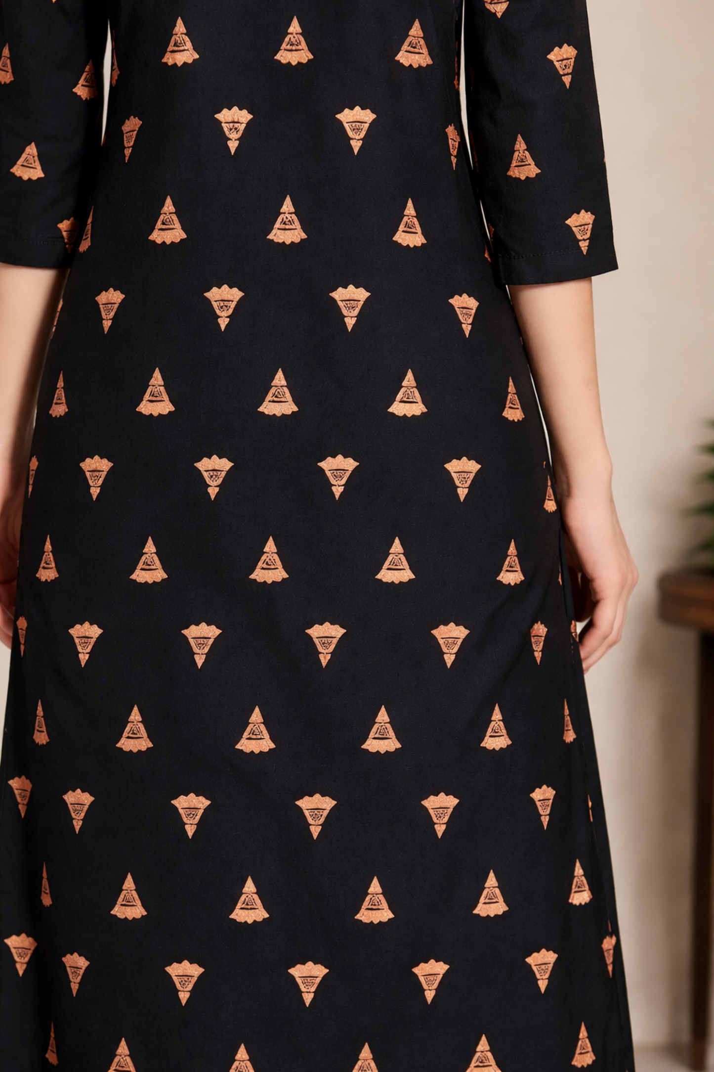 back view of black kurti ladies wear minimal silhouette