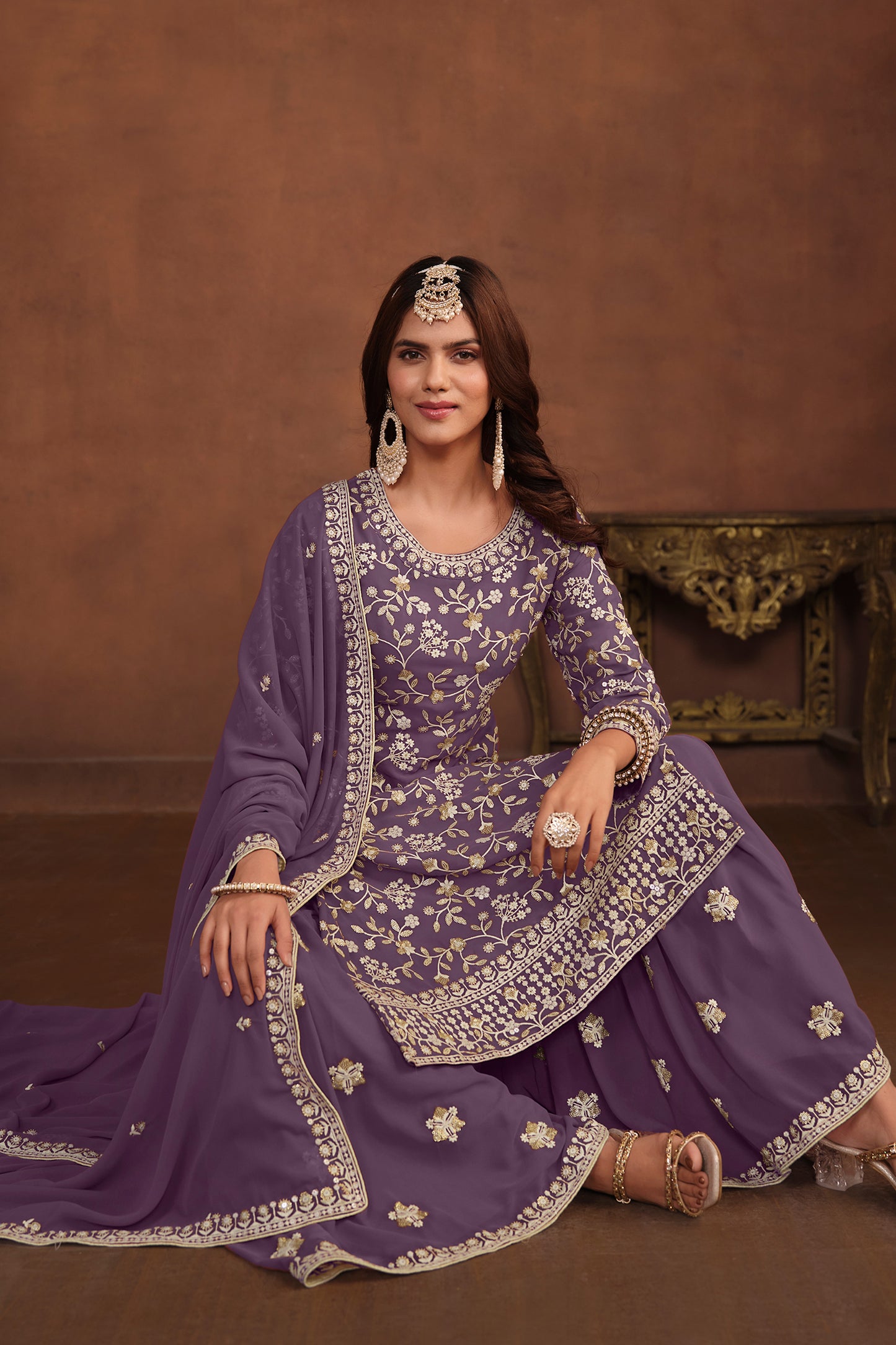 Full outfit of lavender designer party suit styled for wedding wear