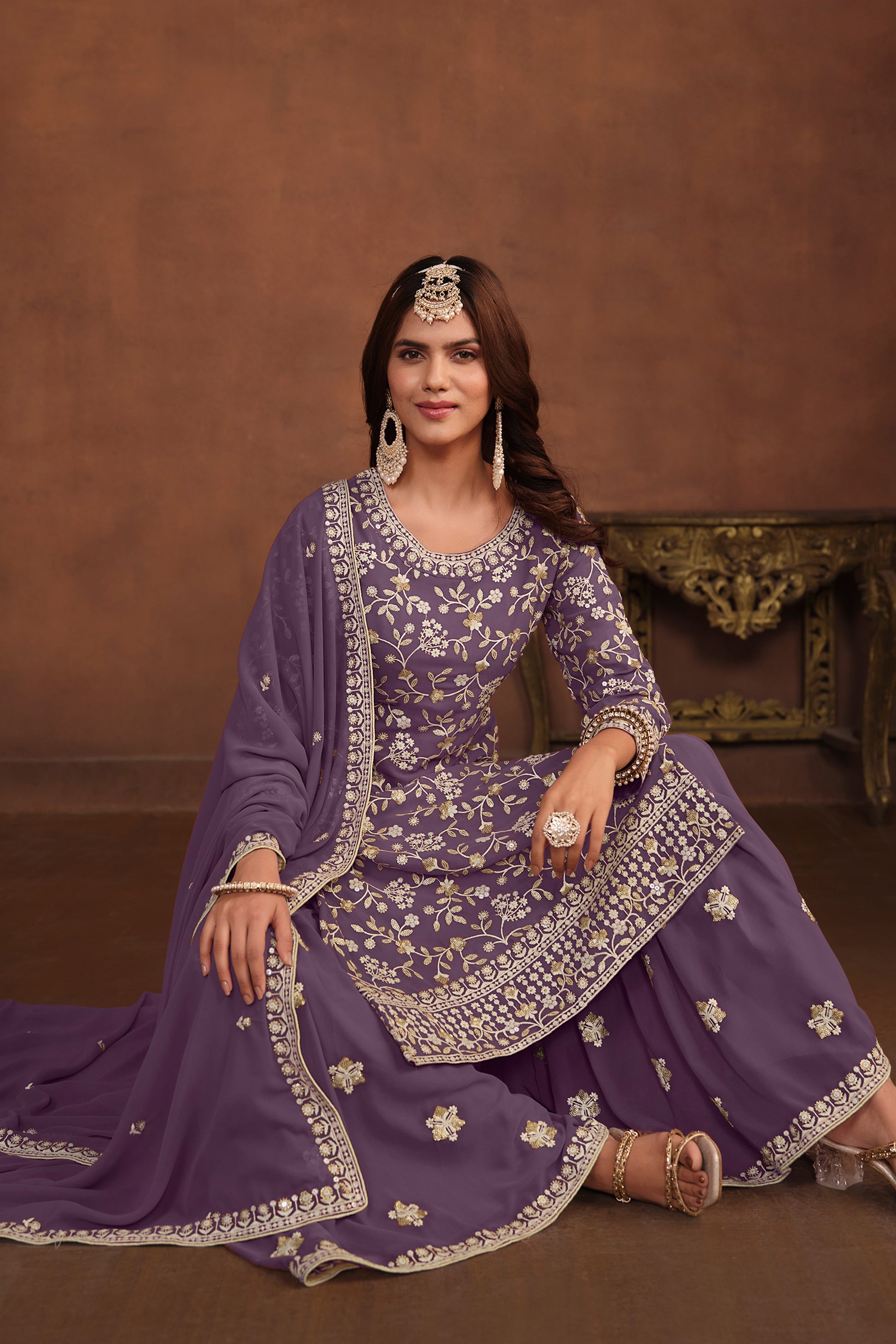 Full outfit of lavender designer party suit styled for wedding wear