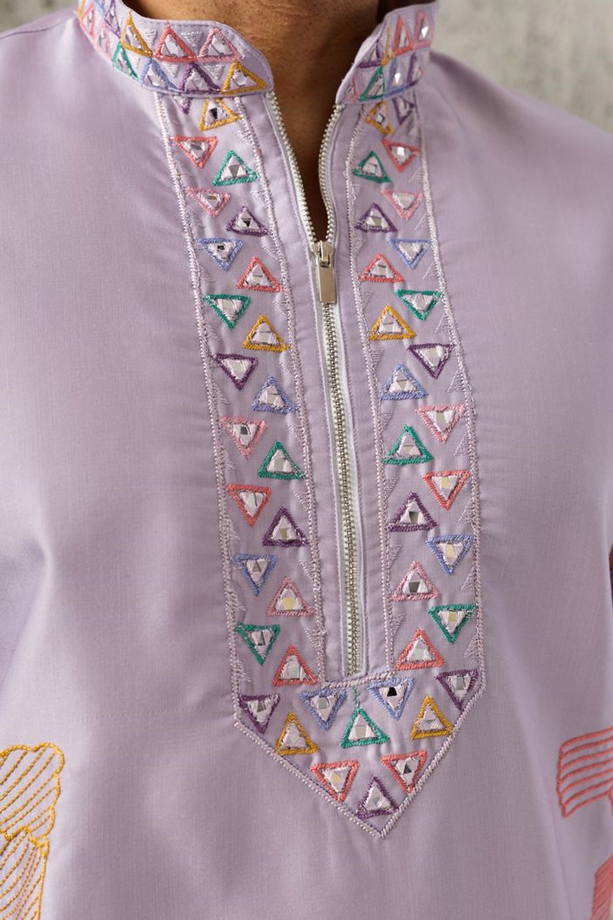 Close-up of thread and sequin embroidery on lavender kurta