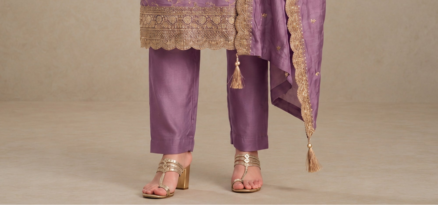 Detailed sequin embroidery work on silk kameez fabric