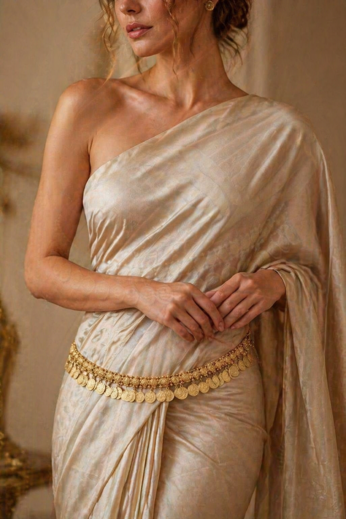 close-up of textured coin waist chain with layered design