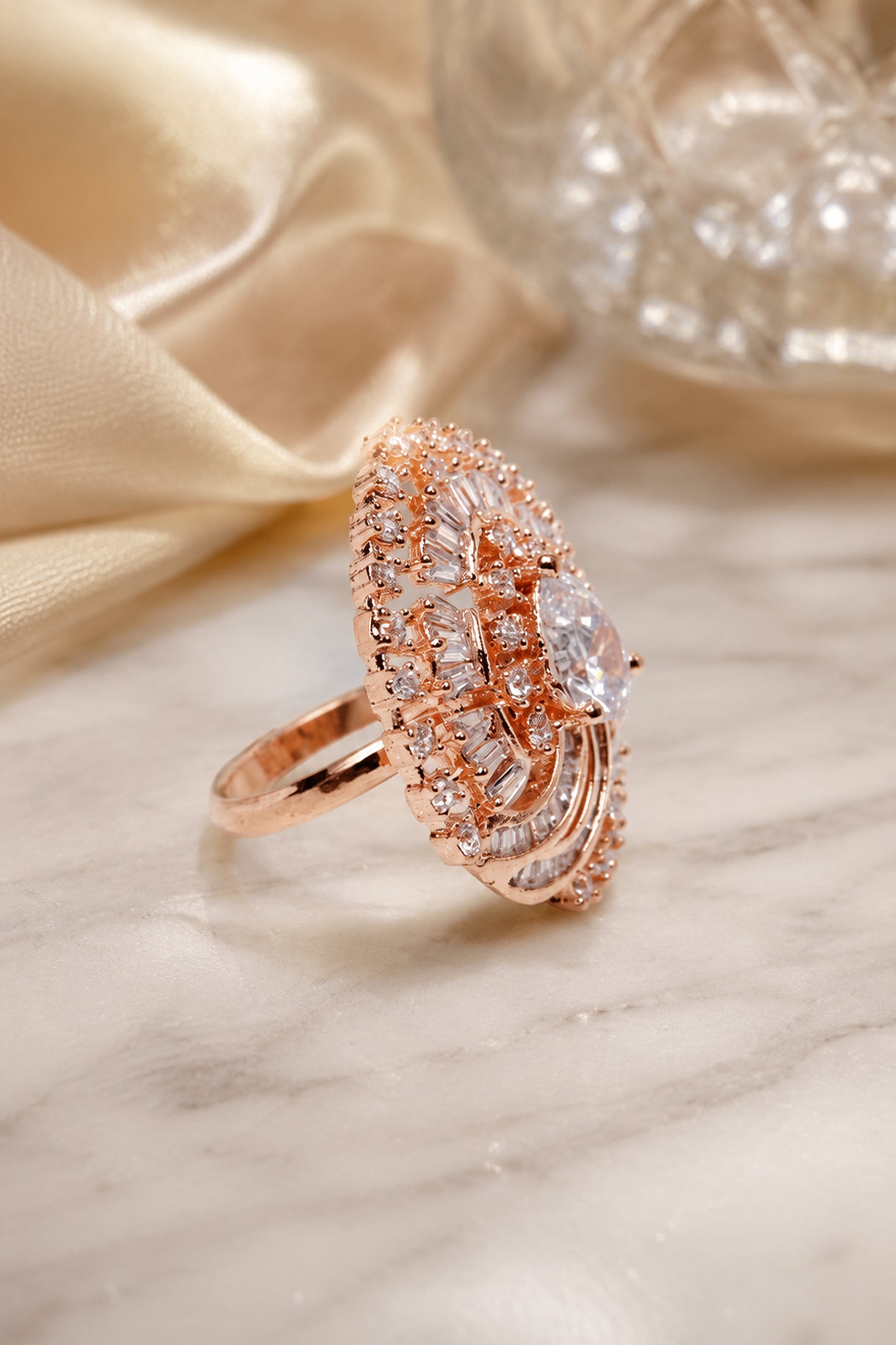 Fashion ring for women displayed on satin background