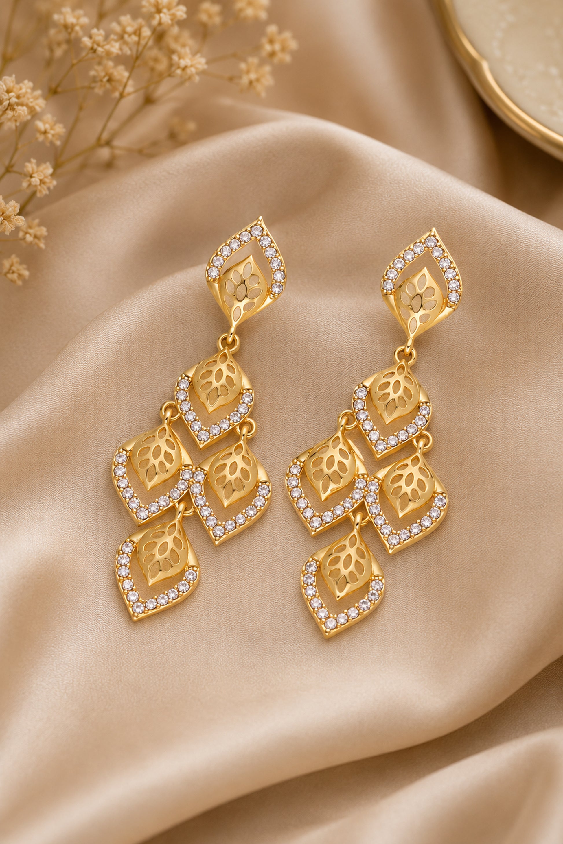 Editorial view of layered chandelier earrings
