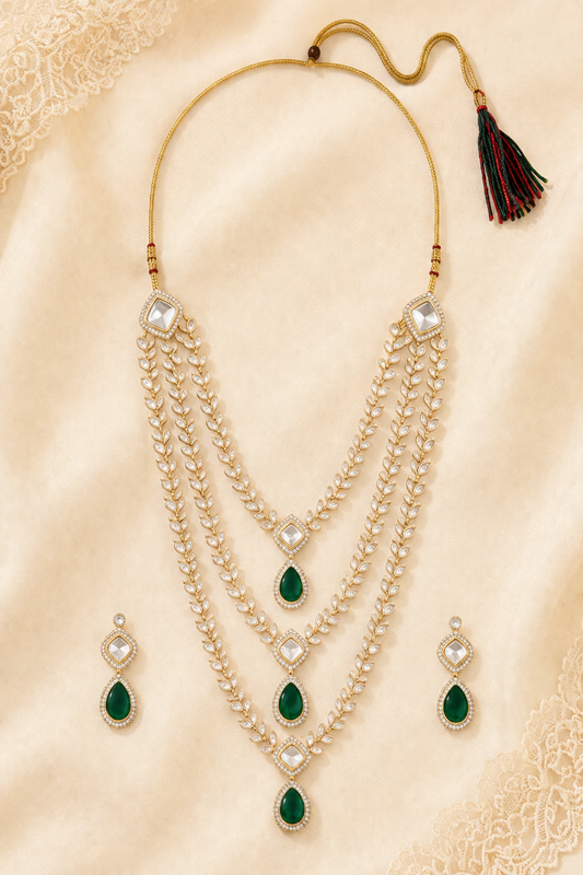 Layered necklace set with green drop stones and clear framed details
