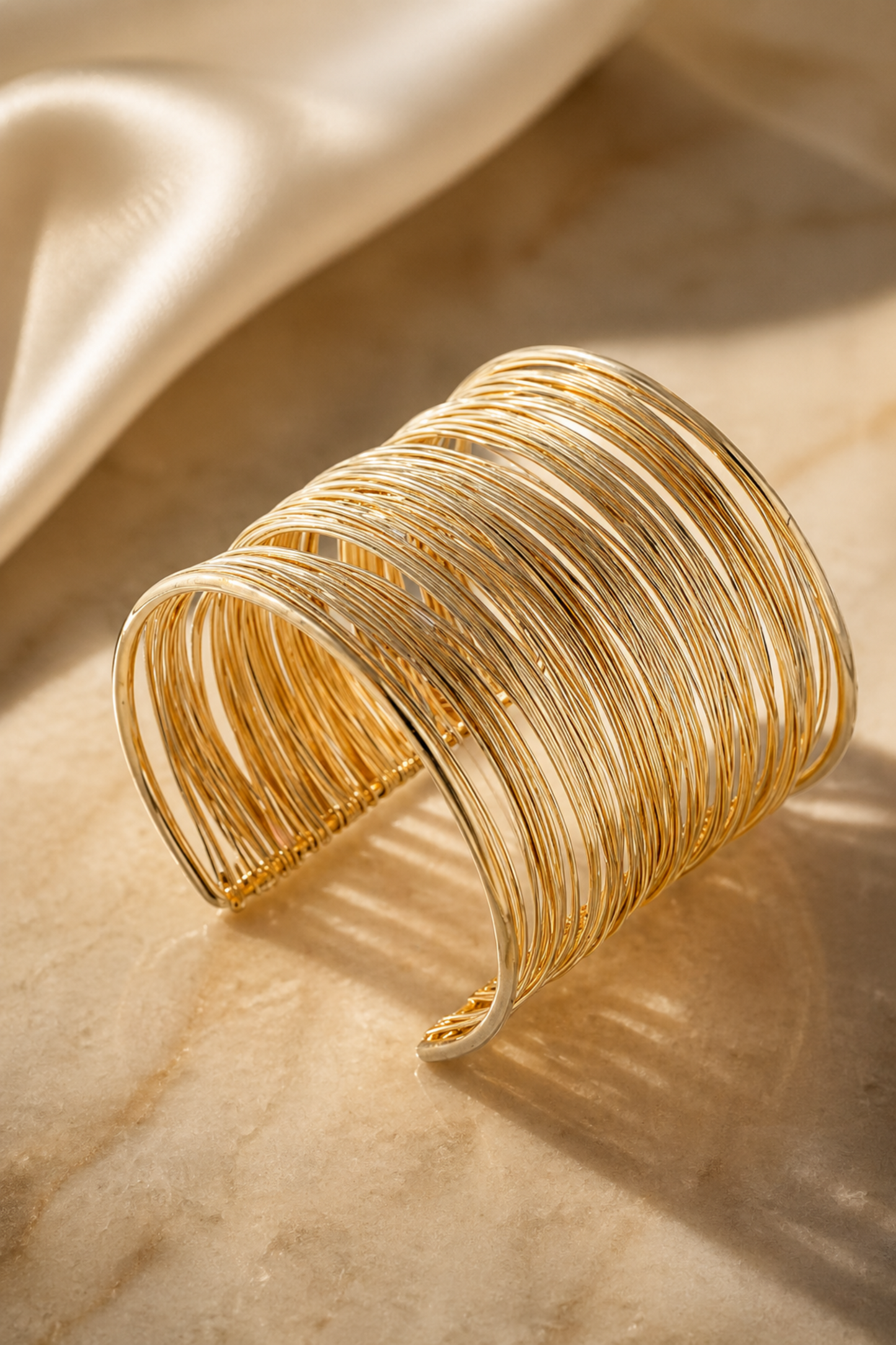 open cuff bracelet with multiple fine metal strands