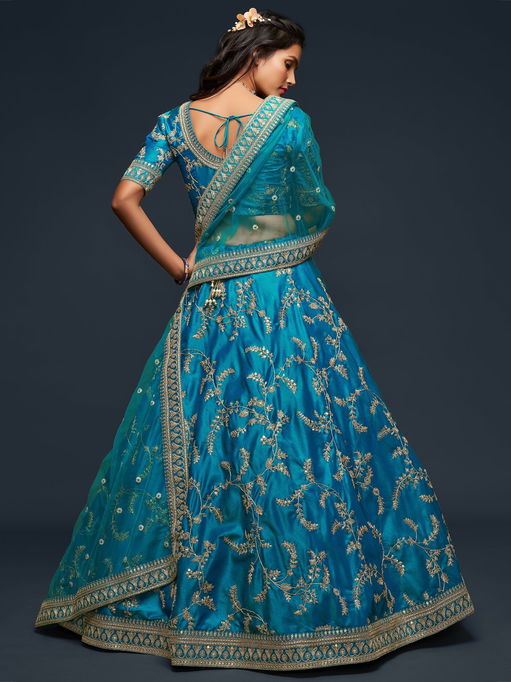 Sequins work shimmer on cyan reception lehenga fabric