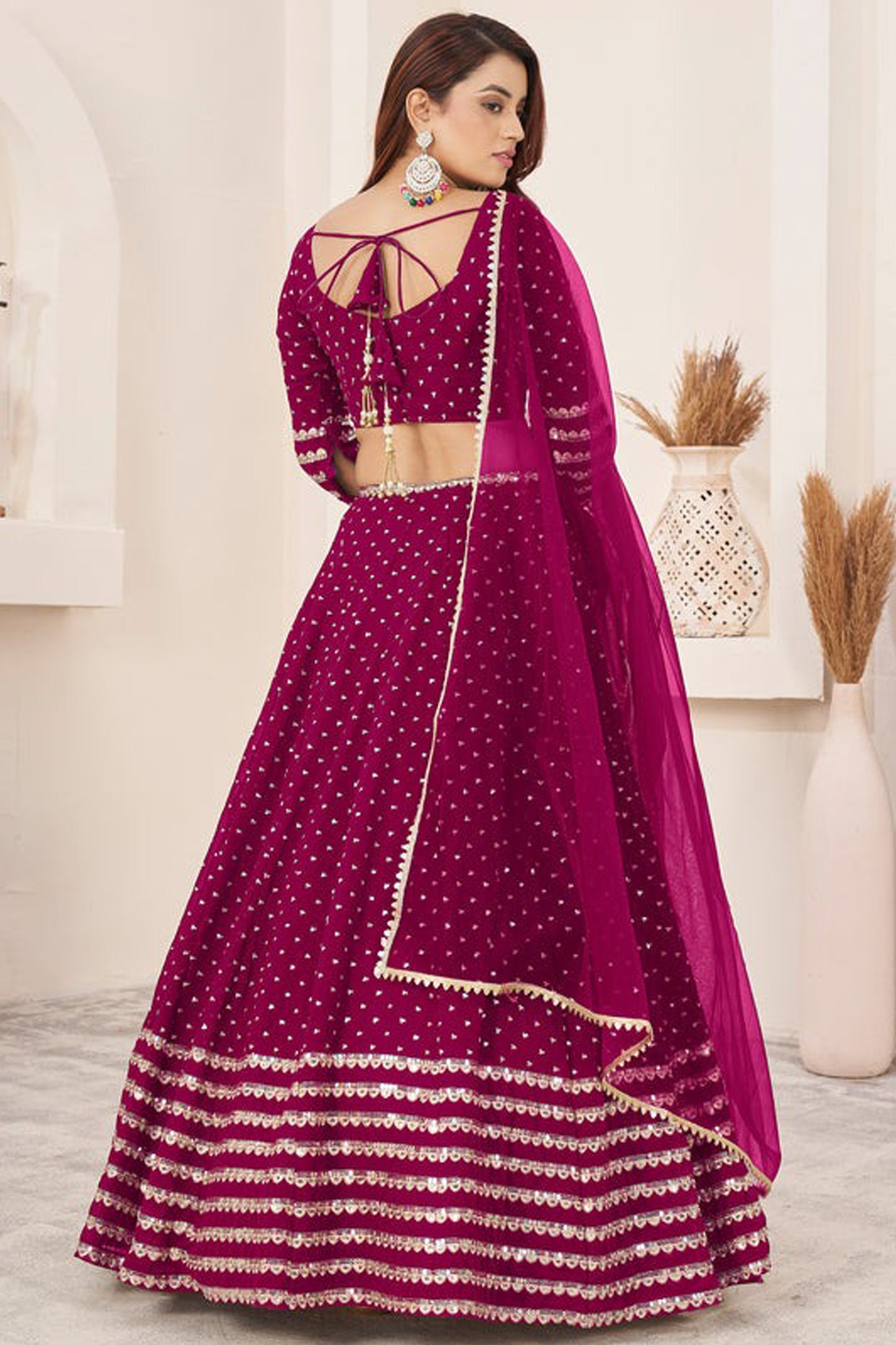 Back view of lehenga choli with dupatta drape