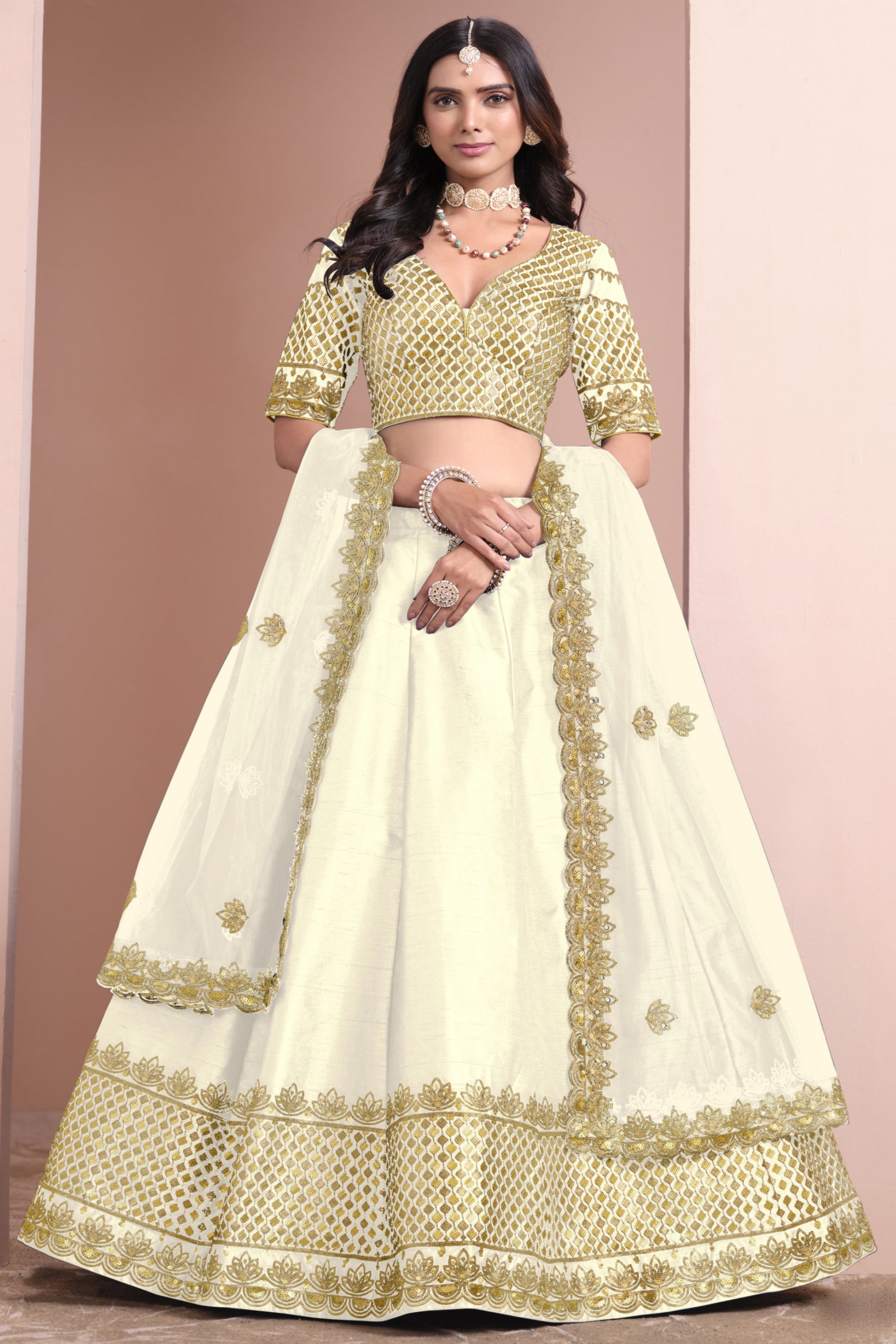 Minimal embroidered lehenga choli in soft ivory tone