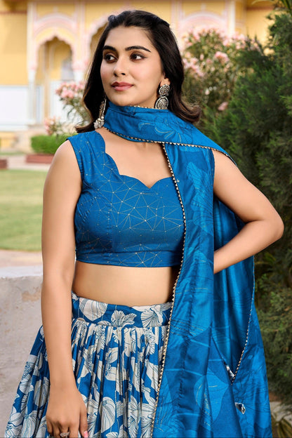 Close-up of floral embroidery on blue Tussar silk lehenga