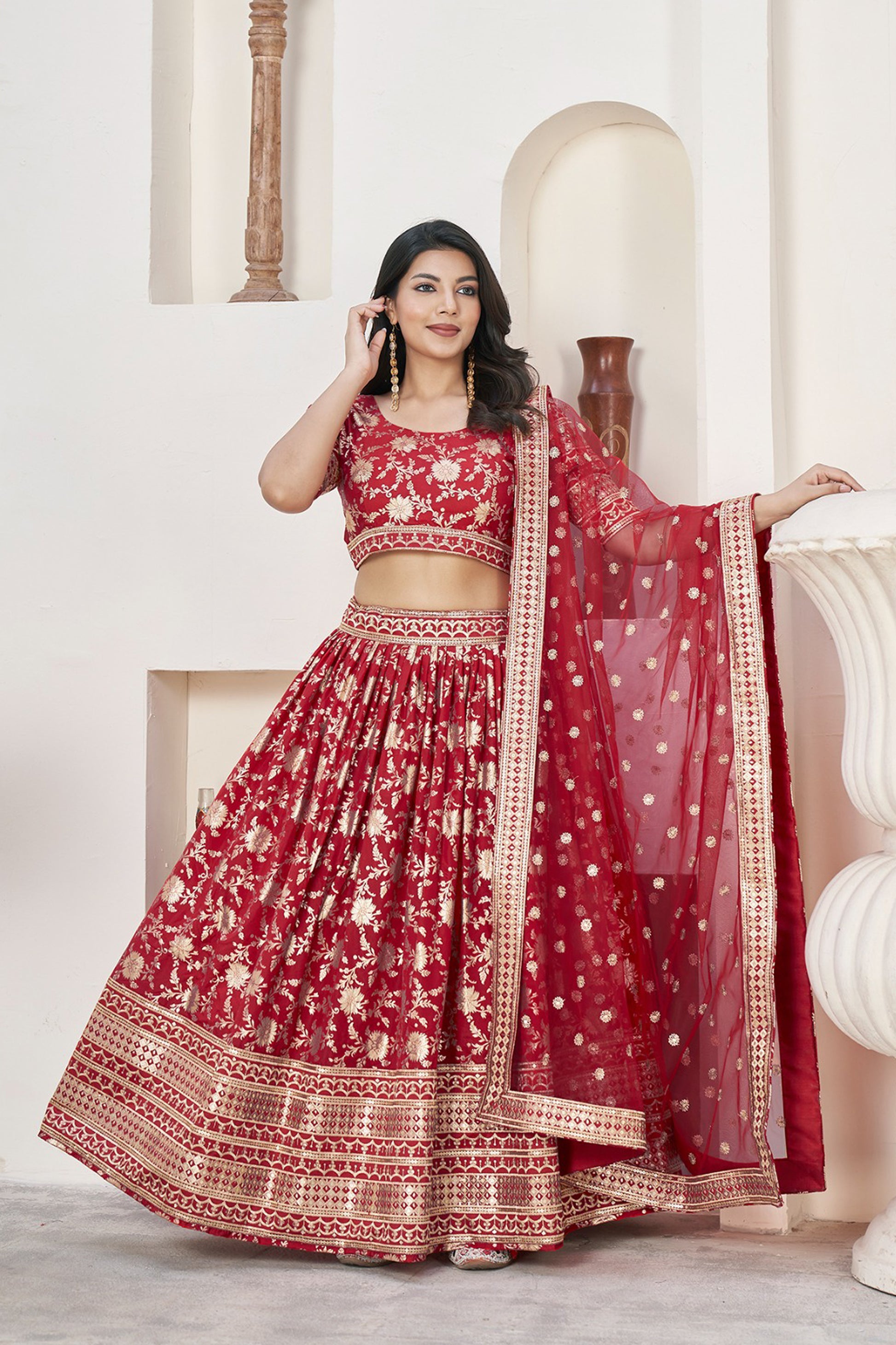 engagement-ready red lehenga with detailed skirt pattern