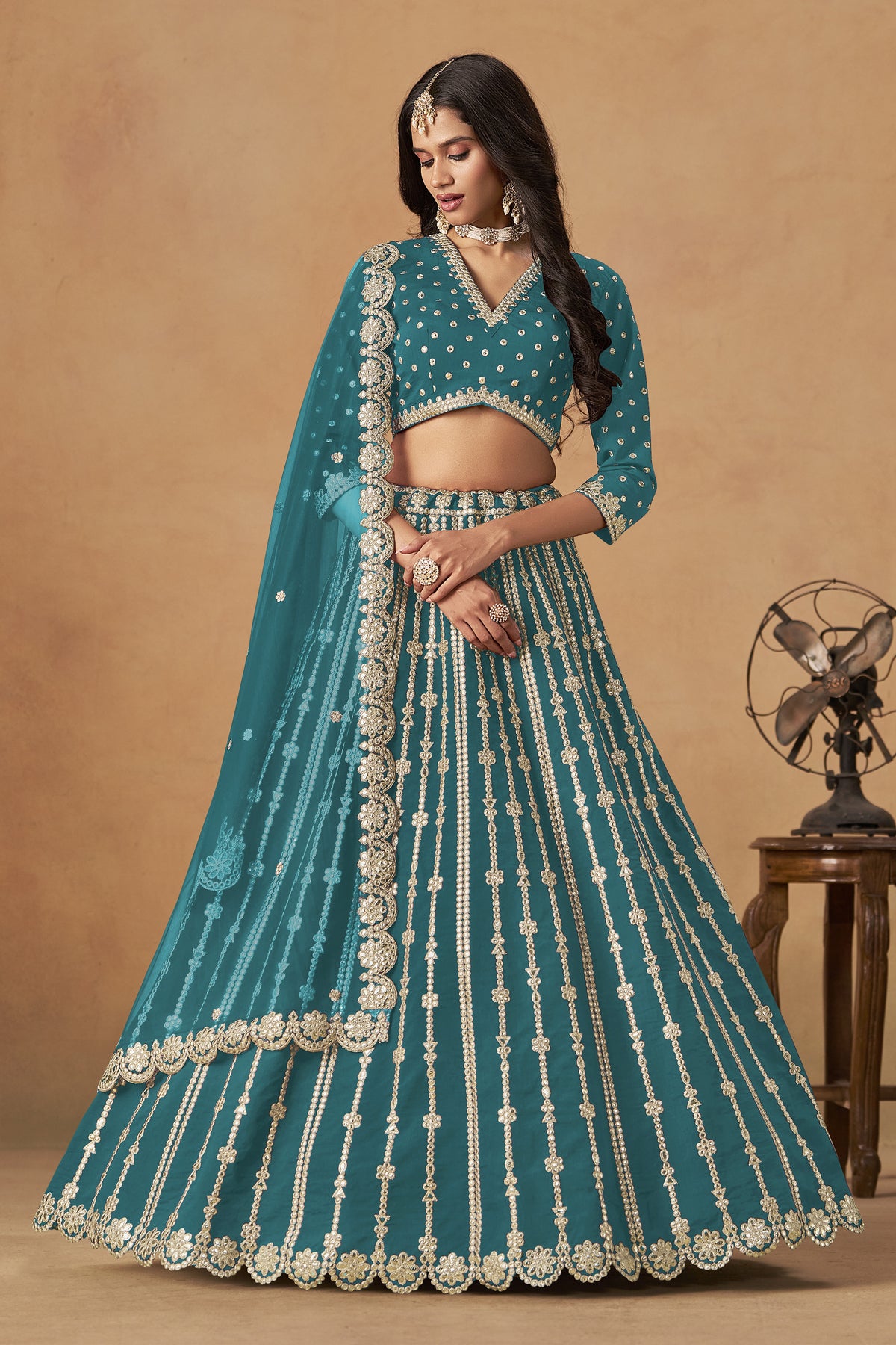 Teal green lehenga choli with heavy embroidery and dupatta