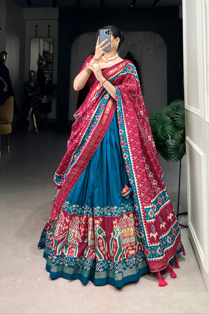 Close-up of foil print work on blue silk lehenga fabric