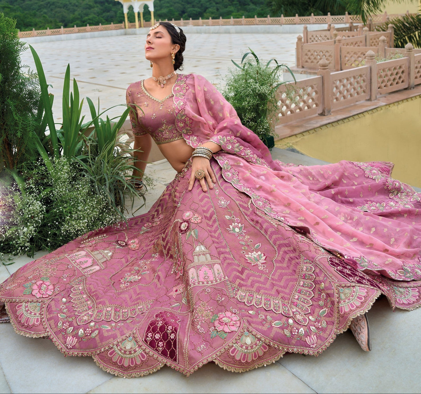close up of viscose satin fabric on pink lehenga choli