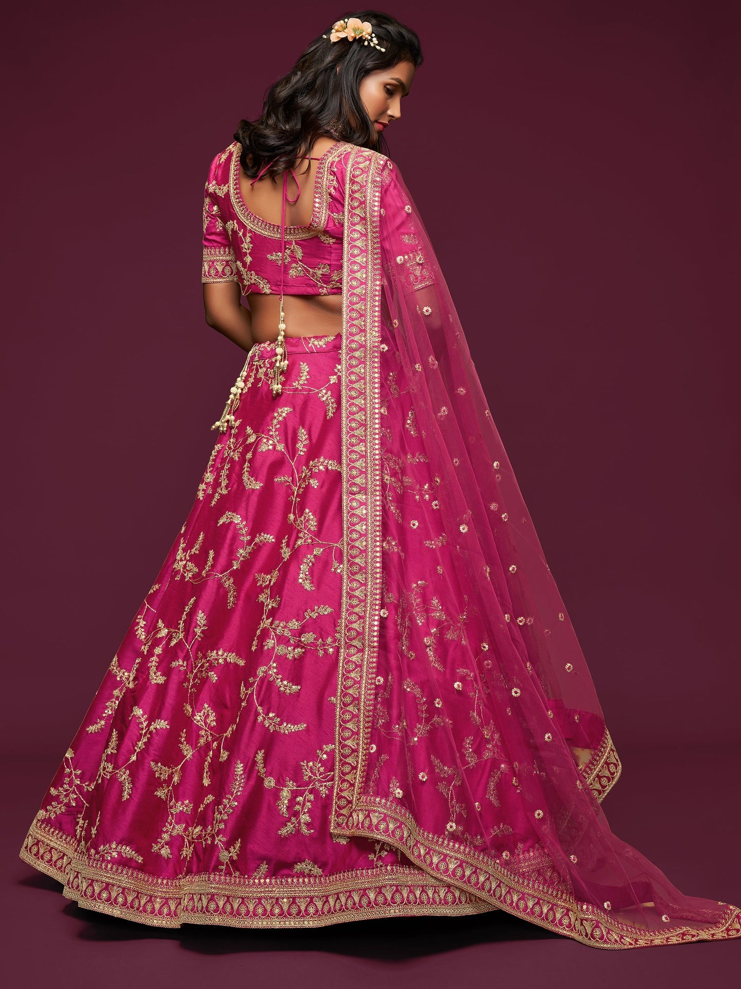 Pink bridal ghagra hemline with intricate zari accents