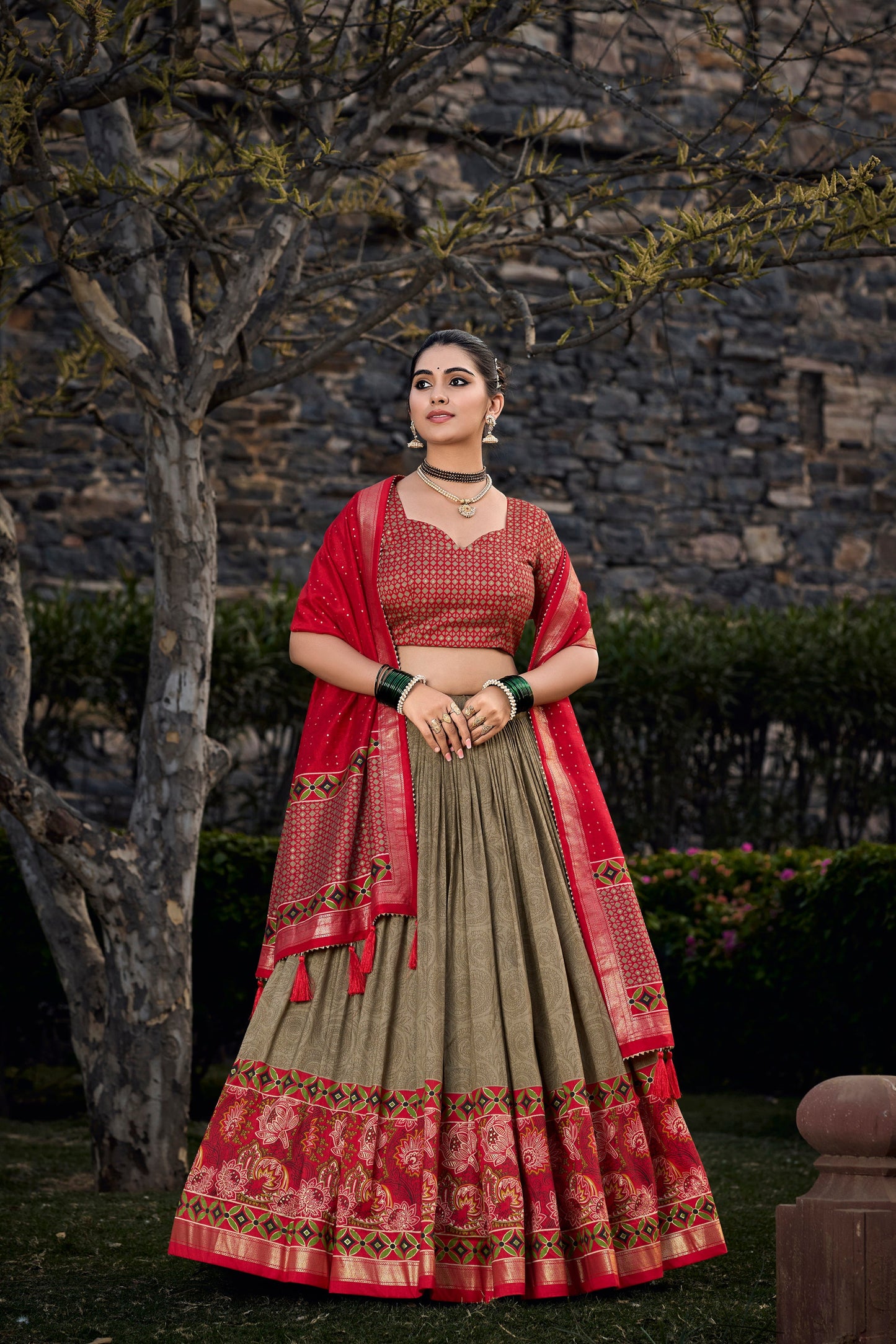 Model wearing green lehenga at evening celebration