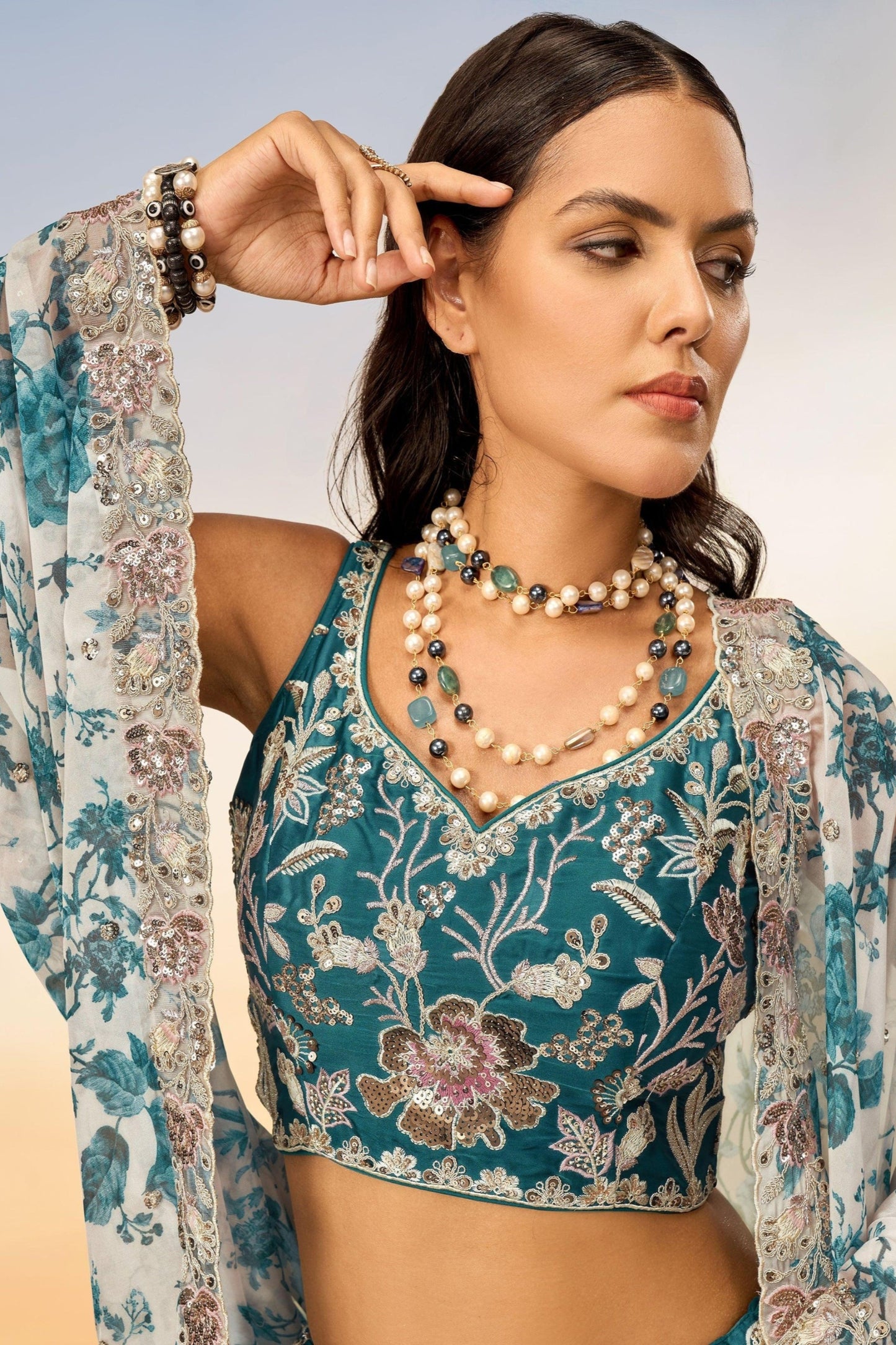 Close-up of thread embroidery and sequins work on chiffon lehenga