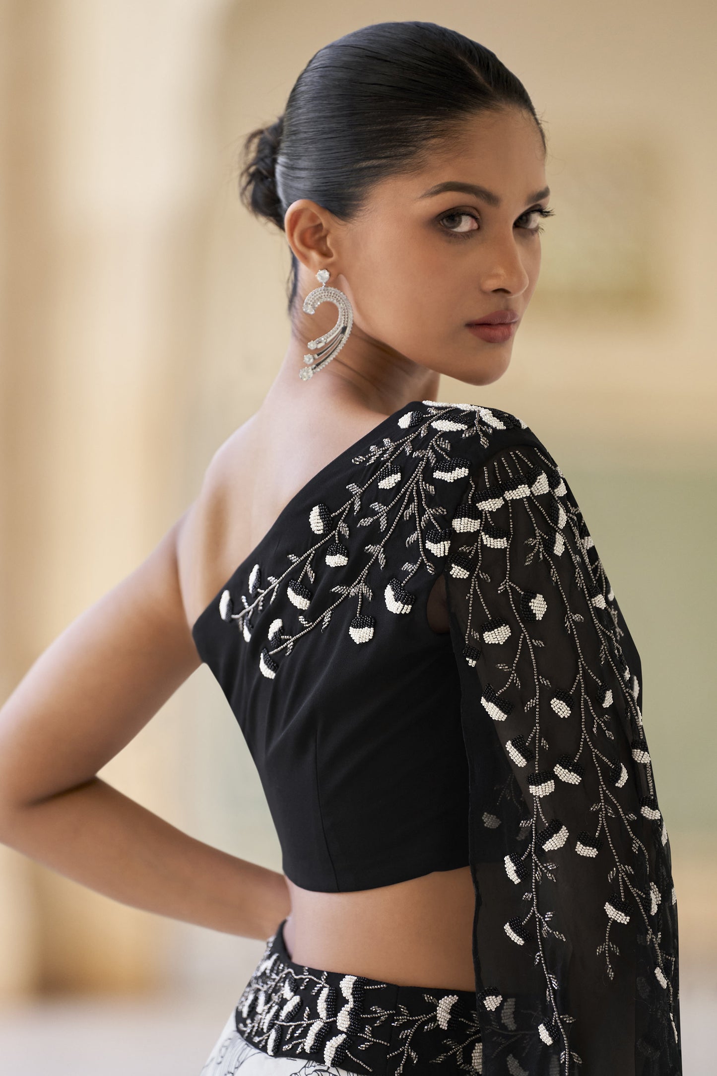 lehengas in black colour back view with elegant drape