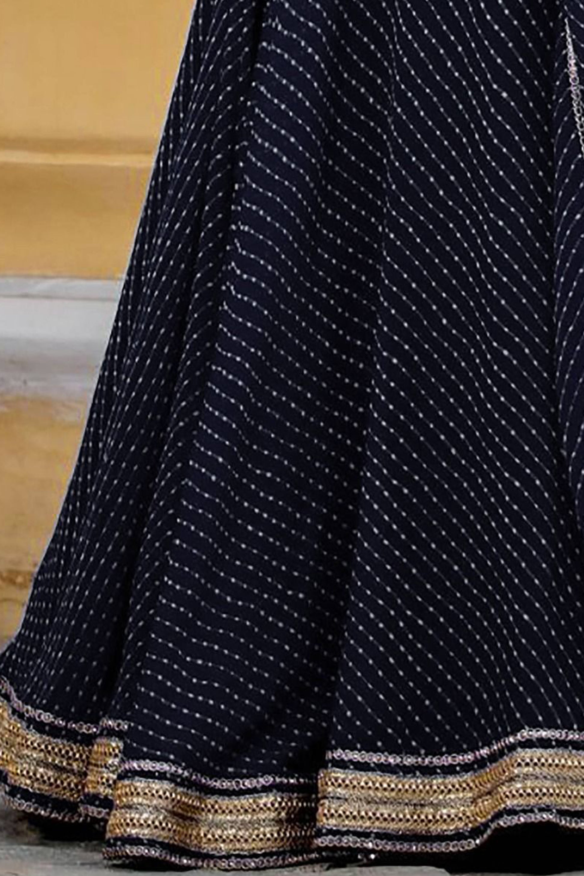 leheriya pattern detail on black wedding lehenga