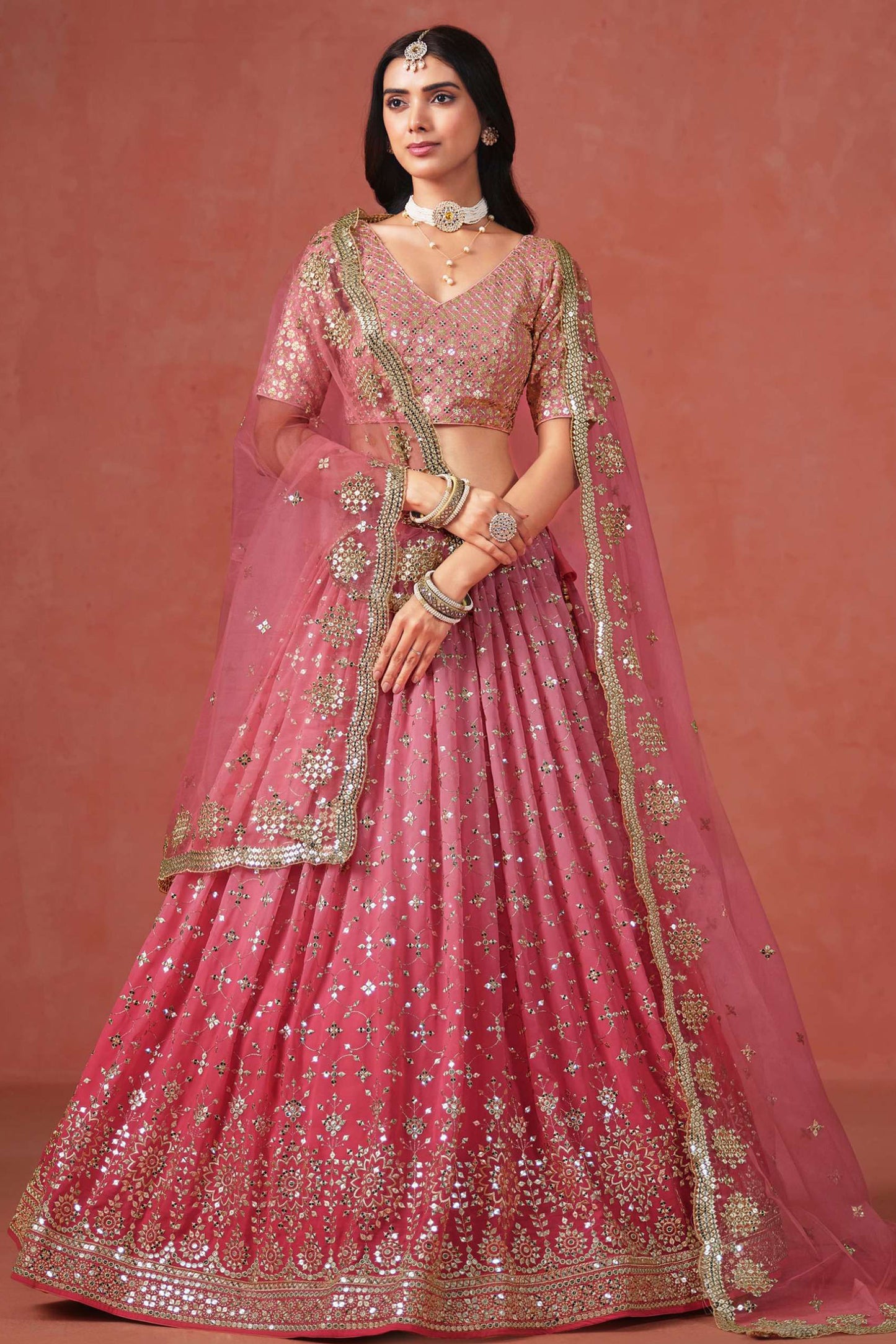 Sequins zari embroidery detail on pink lehenga fabric