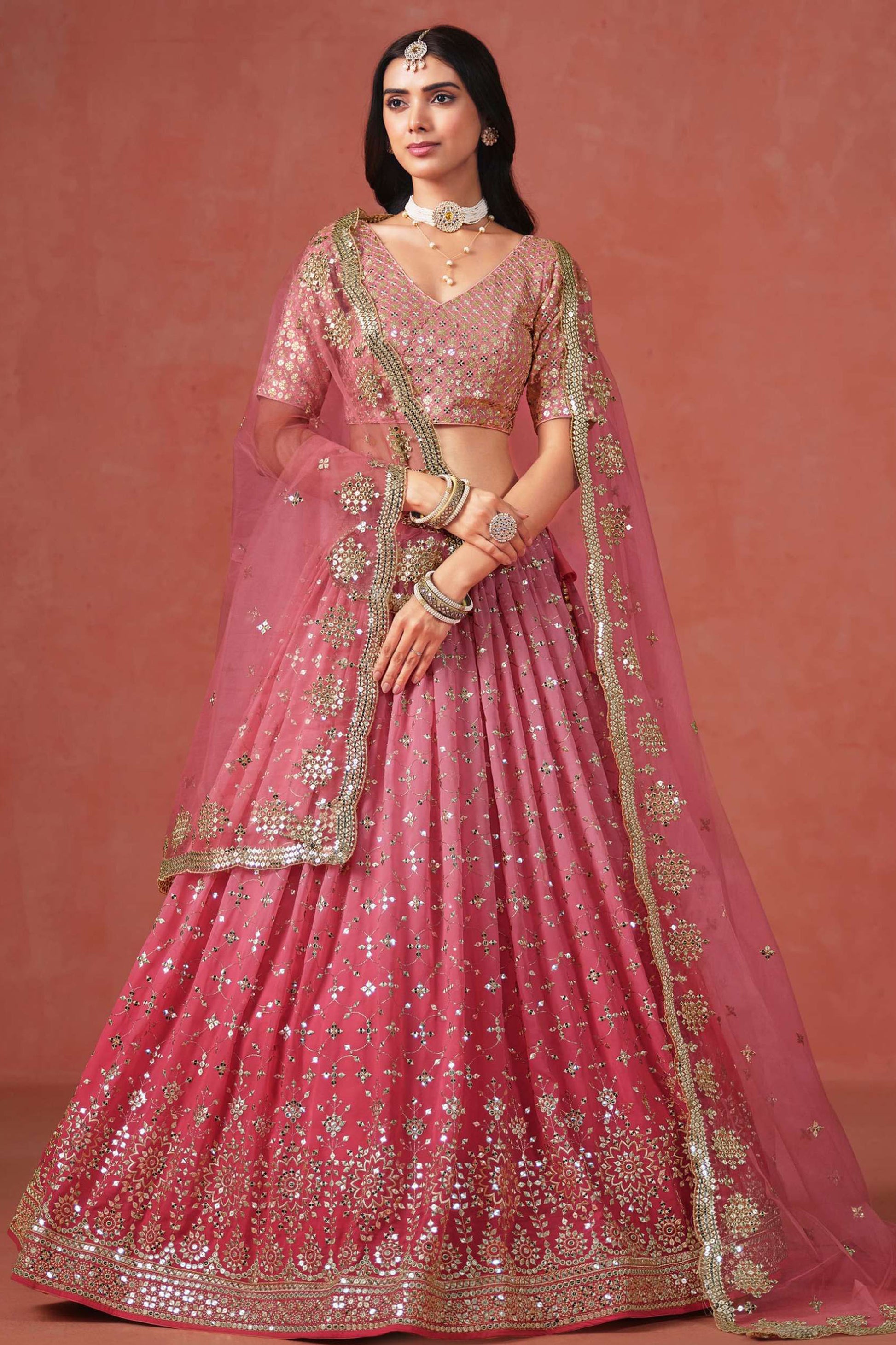 Sequins zari embroidery detail on pink lehenga fabric