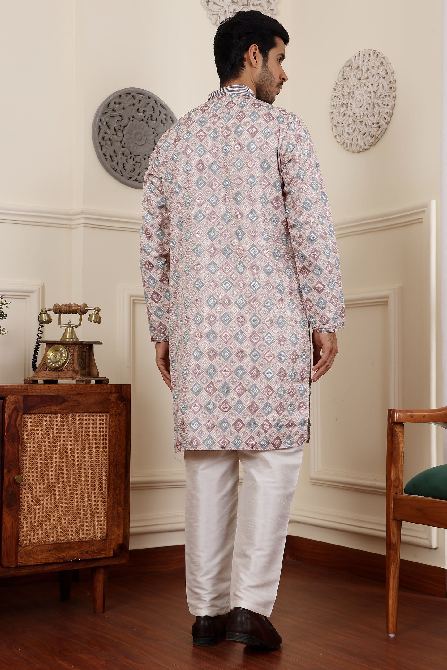 Light pink kurta for men styled as a kurta pajama set