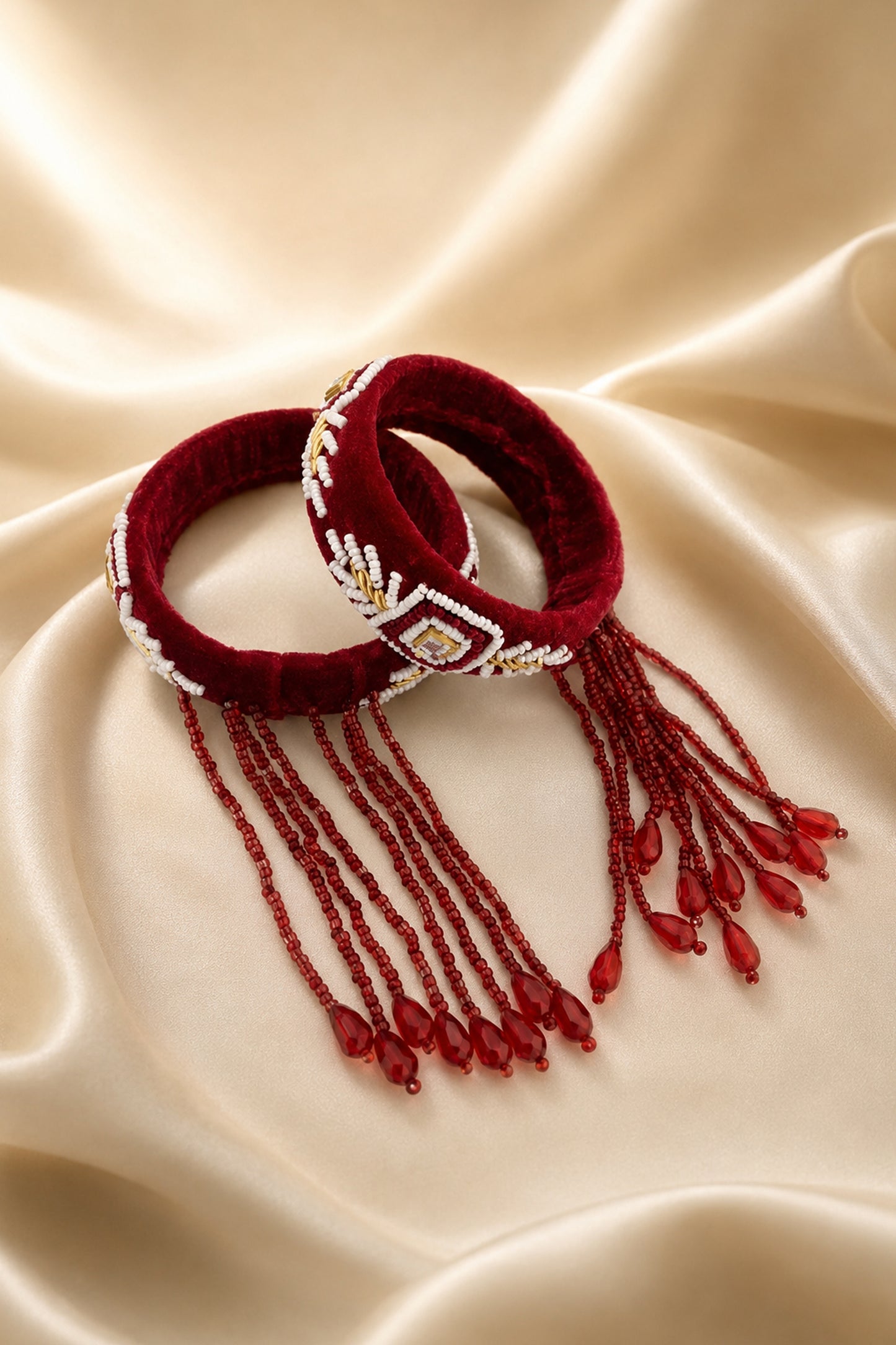 Front view of the openable bangle pair on an ivory display stand