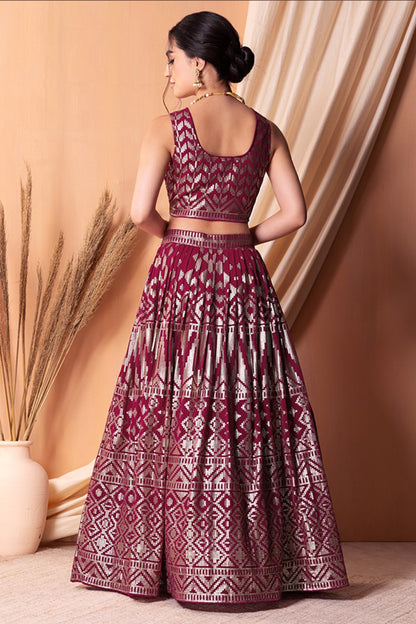 Back view of maroon lehenga choli with detailed blouse work