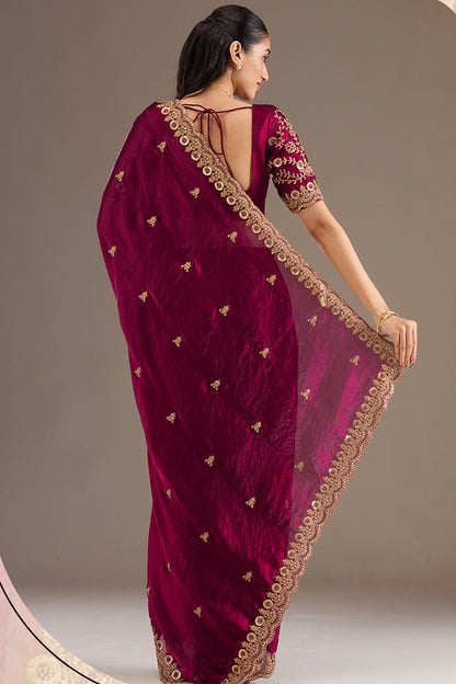 Woman wearing Burgundy Red Saree at reception event