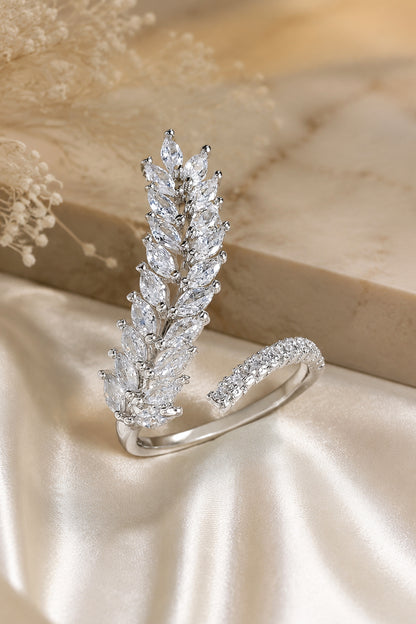 marquise stone ring with layered leaf design on satin background