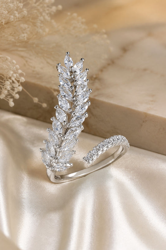 marquise stone ring with layered leaf design on satin background