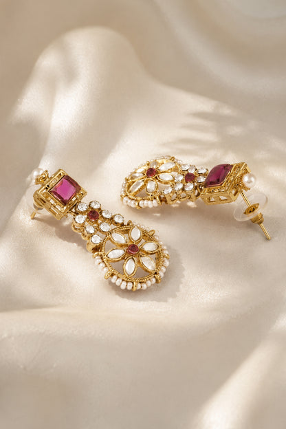Detail view of layered floral necklace with pearl-like bead edging and polished gold-tone finish