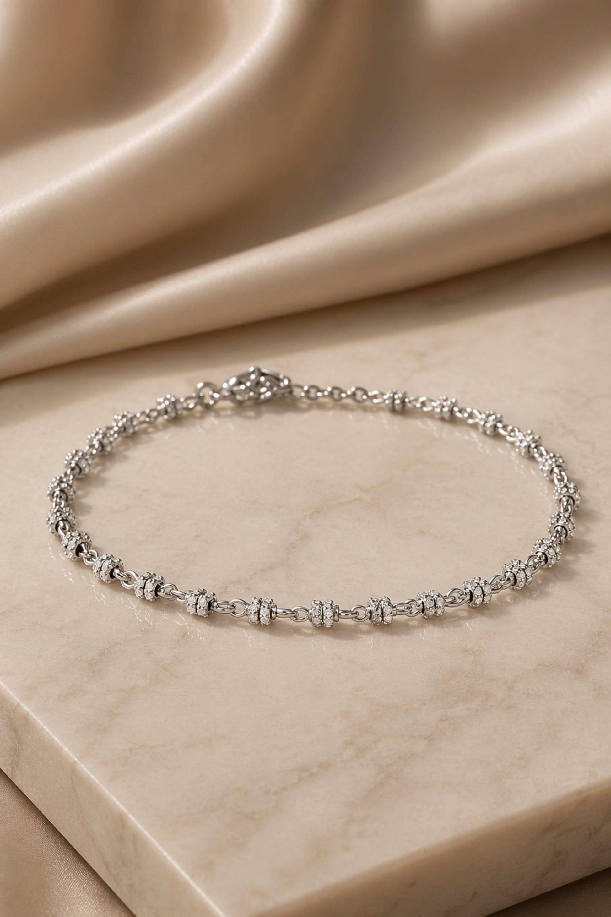 polished anklet with textured charm detail