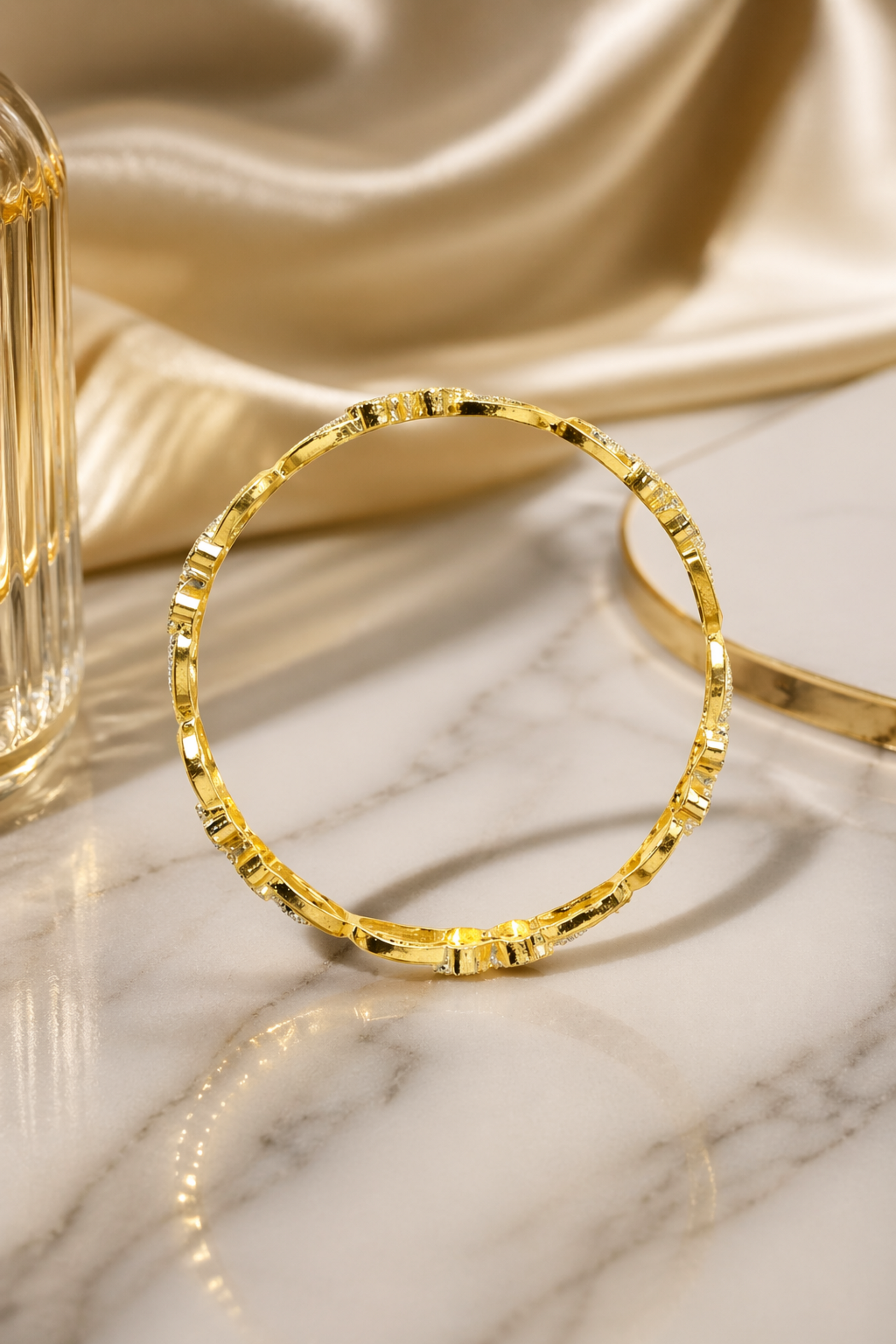 minimal circular gold bangle with linear texture detail