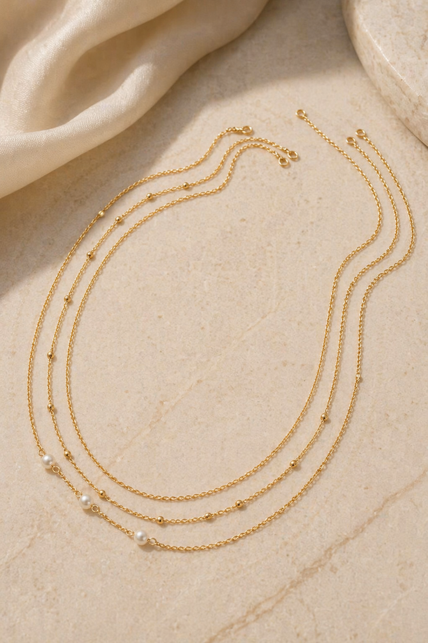 close-up of fine chain waist jewelry with small beads
