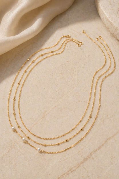 close-up of fine chain waist jewelry with small beads