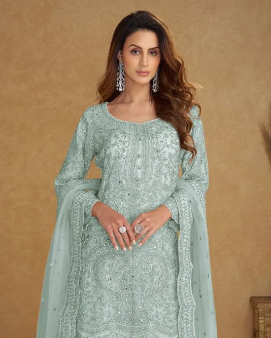 Close-up of heavy embroidery on mint blue real net suit