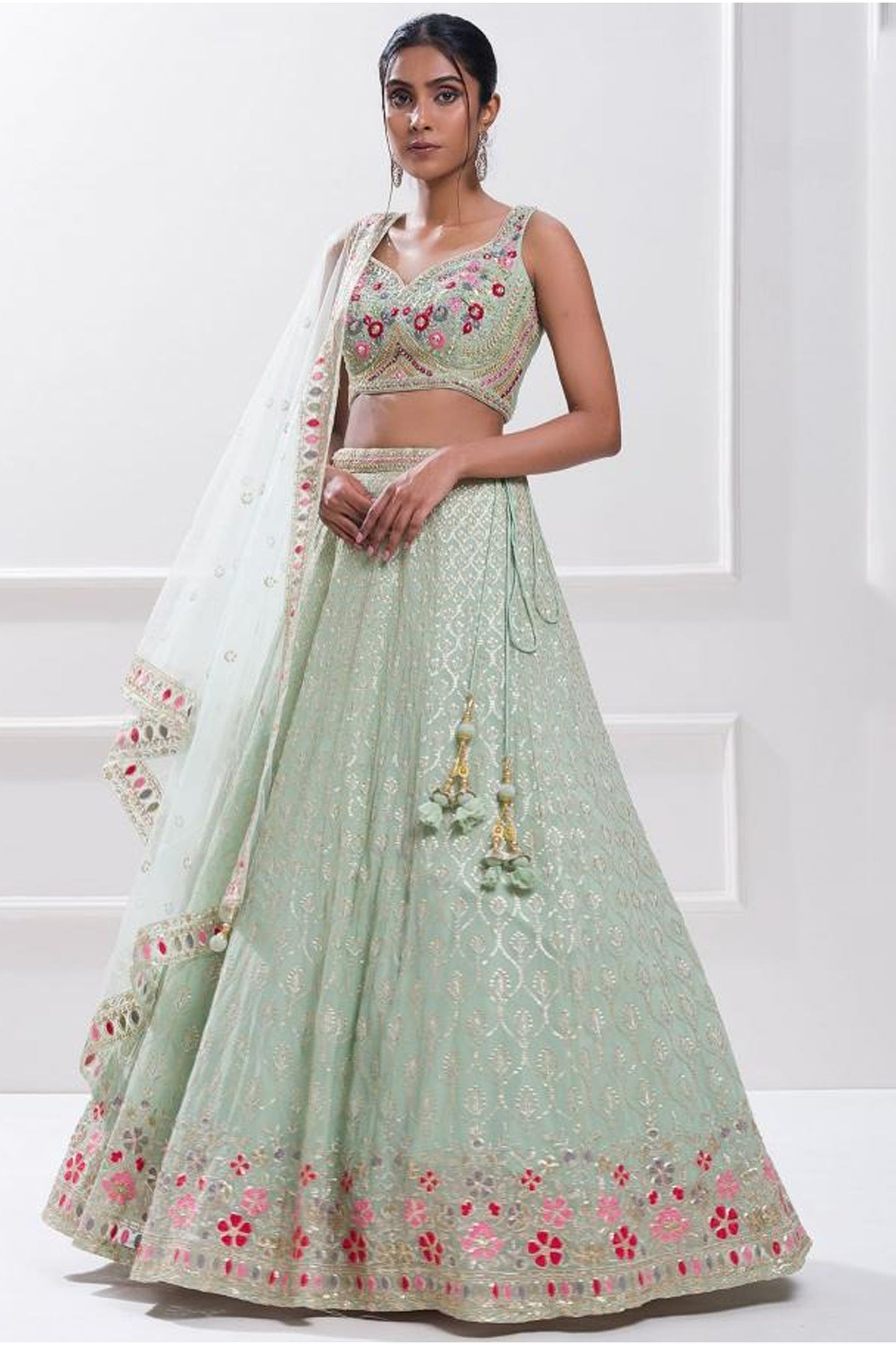 Mint green lehenga choli side profile with sequins work