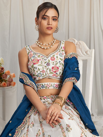 Close-up of hemline embroidery on white ghagra choli