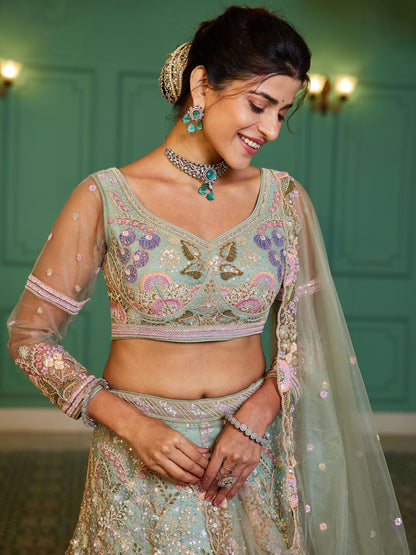 Close-up of sequins and thread work on green lehenga choli