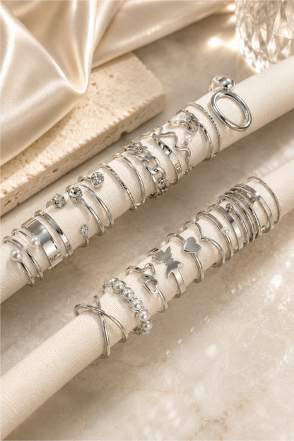 Assorted rings displayed on cream fabric jewellery rolls