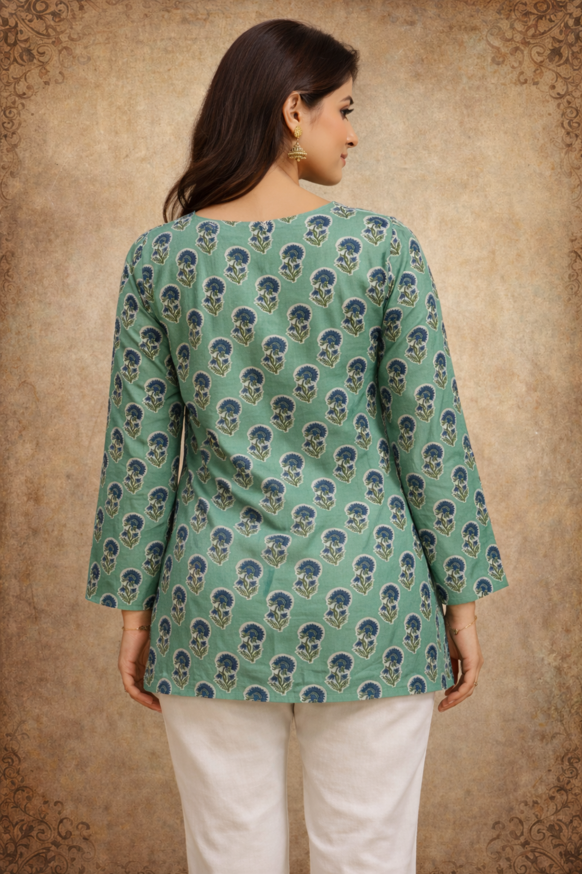 Back view of sage green top with printed design