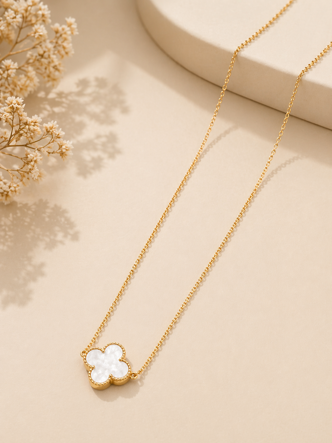 minimal gold chain necklace flat lay