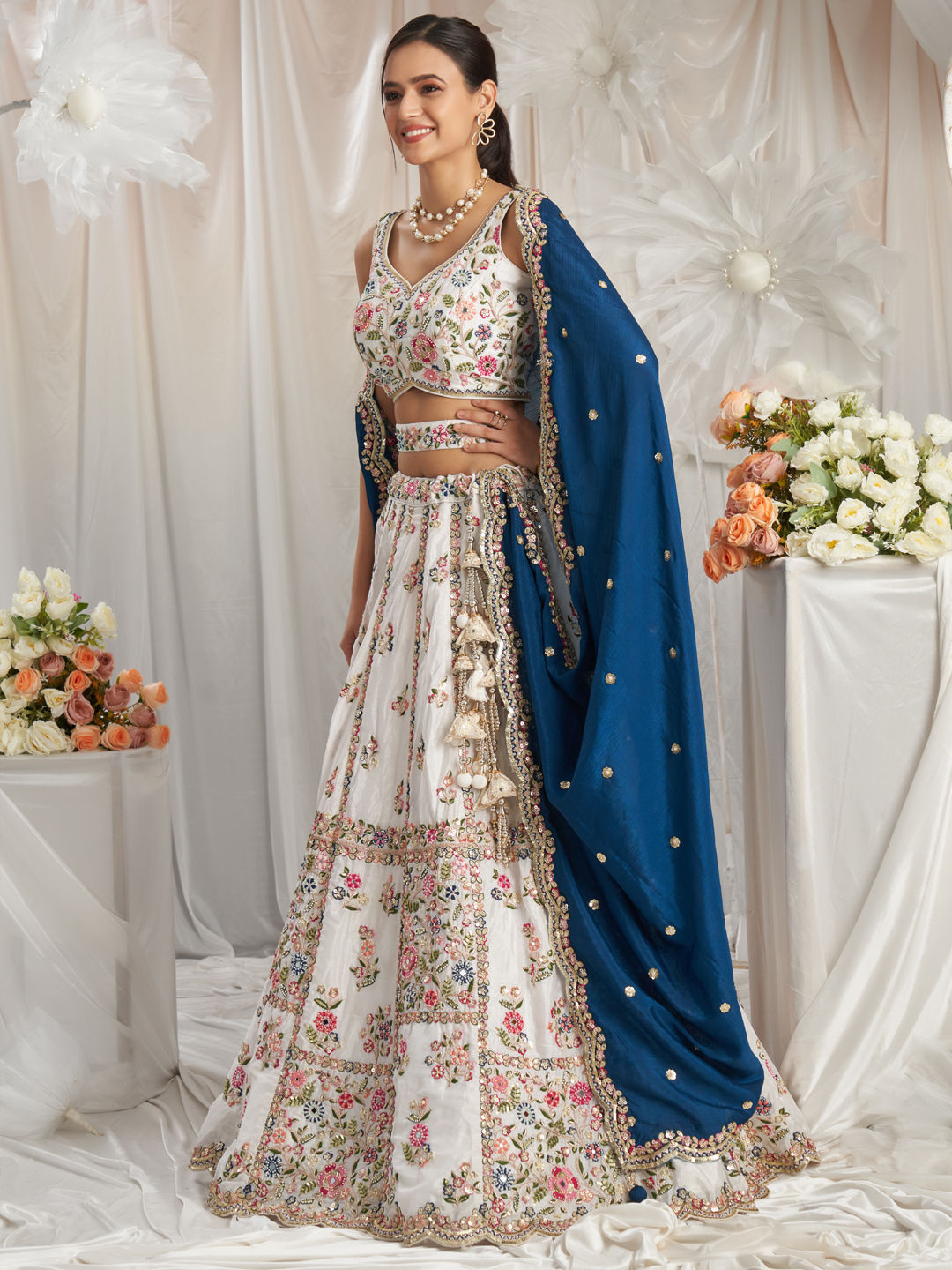 White lehenga choli paired for roka function styling